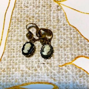 Vintage cameo earrings on black onyx with alabaster faces. Gold plated clips